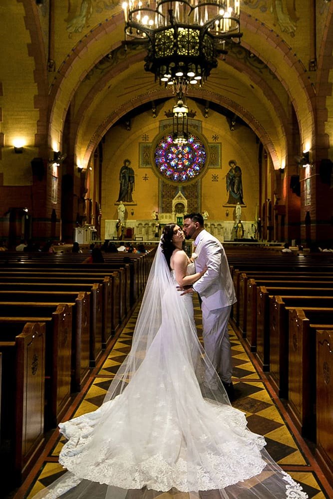 Wedding videography Los Angeles Image369 — Couple kissing in church